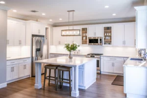 white theme modern kitchen with bright lighting and center countertop